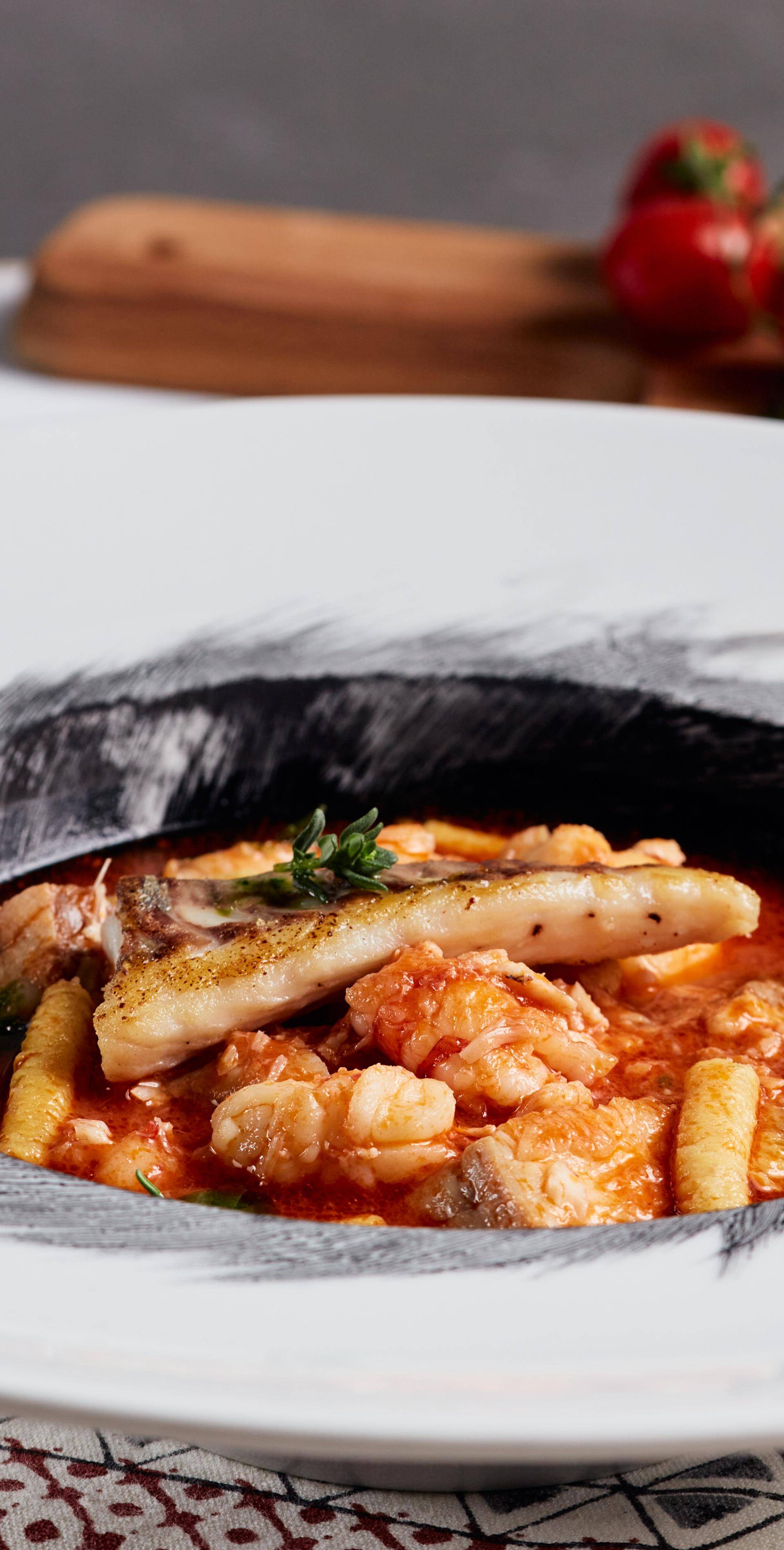 Passatelli in zuppa di mare al nero di seppia - Ricette Companion | Moulinex